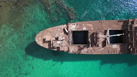 fantastic aerial view flight abandoned destroyed ghost shipwreck on beach sandbank lanzarote canary islands, sunny day spain 2023