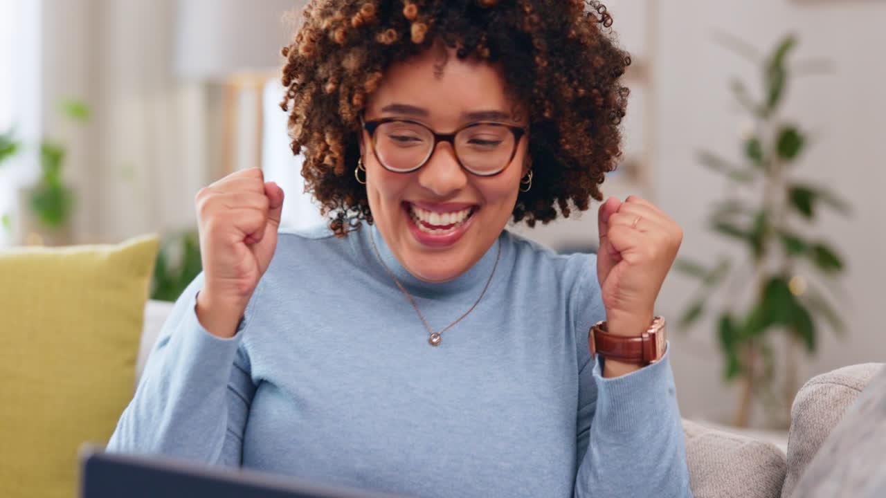 Happy woman with laptop, fist pump and yes to win