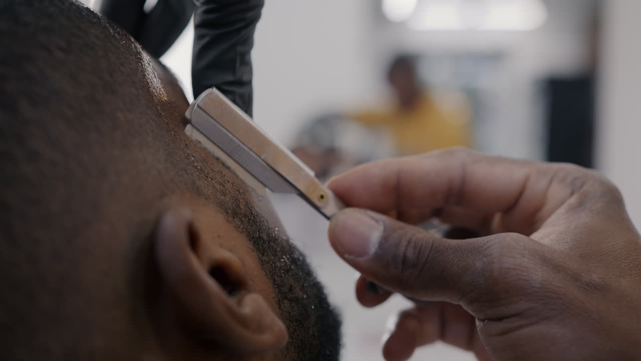 Barber Shaving a Man's Head