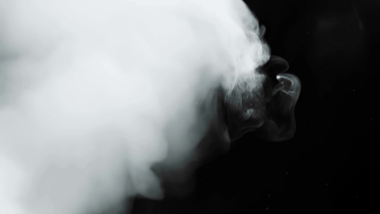 White Smoke Swirling Against a Black Background
