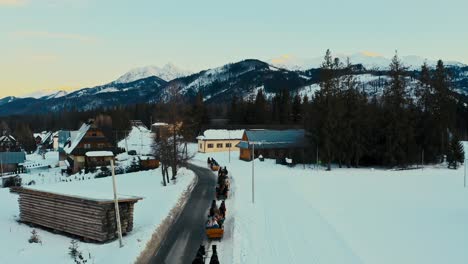 Touristic-Drone-Aerial-View-of-Horse-Sleigh-Ride-in-Winter-Snow-Polish-Mountains