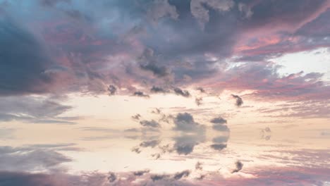 futuristic background consisting of time lapse clip of white fluffy clouds over blue sky and their reflection, video loop