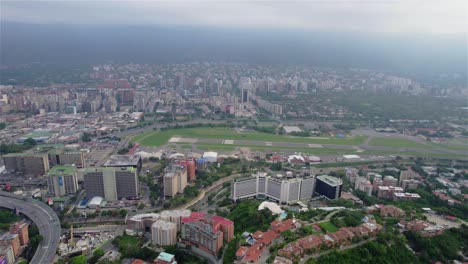 caracas urban landscape: aerial drone view of the city with el ávila and la carlota airport