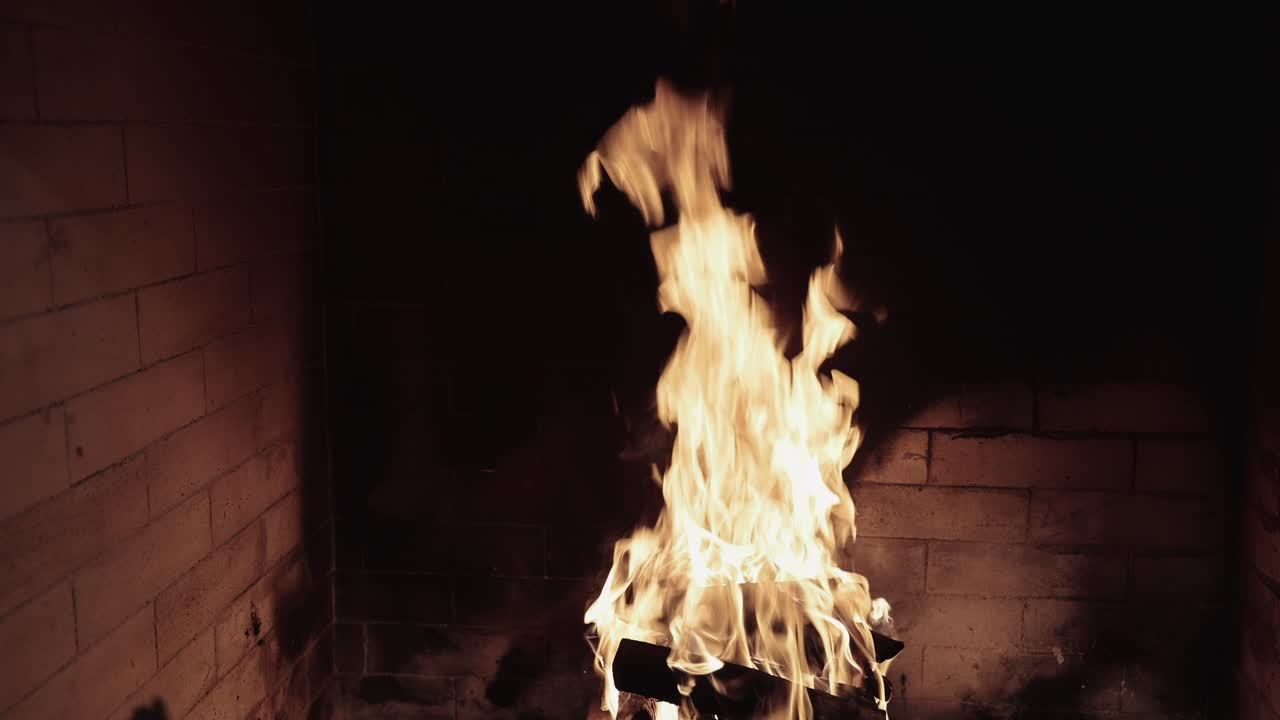 Warm Flames Burning in a Brick Fireplace