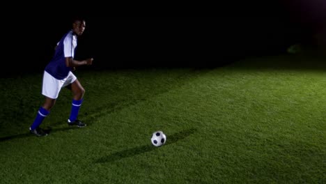 Soccer-player-kicking-the-ball-4k