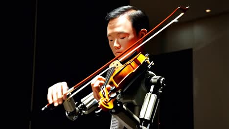 robot playing the violin
