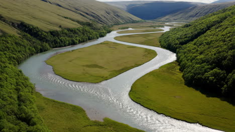 winding river through a green valley landscape