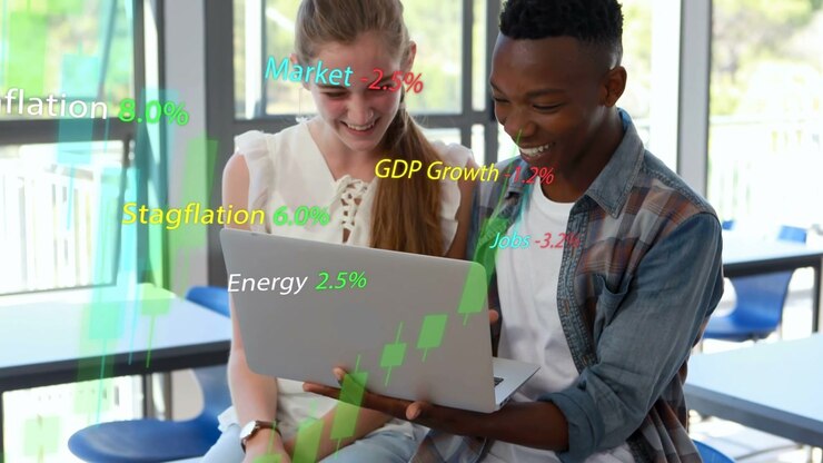 Young Students Analyzing Financial Data on Laptop with Digital Overlays