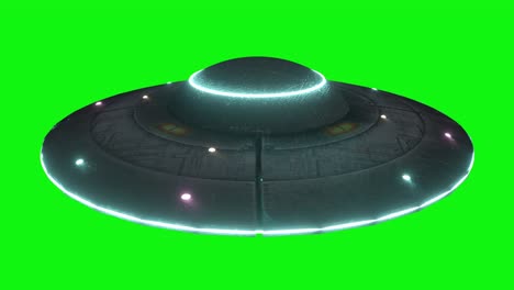 ufo - flying saucer with blue lights rotating infinite repeat loop isolated on green screen background