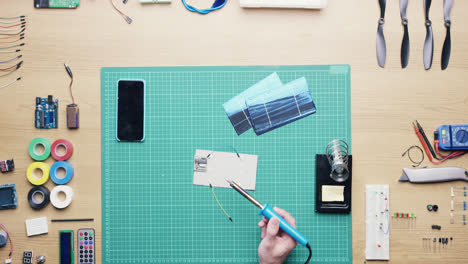 top view technician soldering solar panels green energy concept from above - red epic dragon