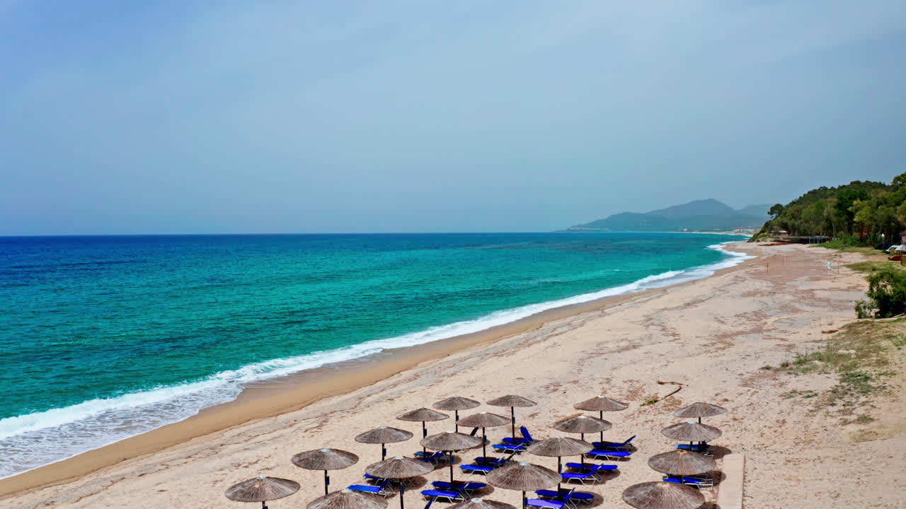 Beach with umbrellas by the sea