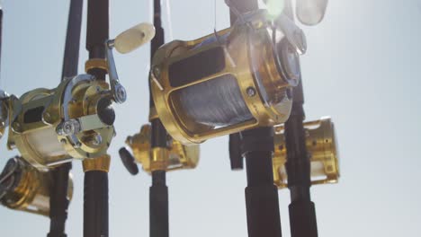 close up detail of fishing rods standing up on a boat