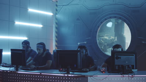 of multicultural female cybersport team winning game and cheering medium shot of young muslim female gamer and asian teammate playing in online video game with tense and focused look winning match cheering and pumping fists while celebrating victory