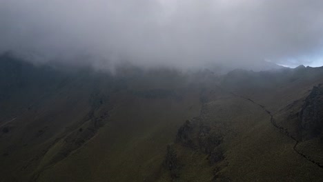 Hyperlapse-of-the-clouds-flowing-into-the-mountain-path