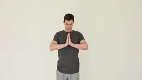 man demonstrating various hand gestures for spirituality and stopping
