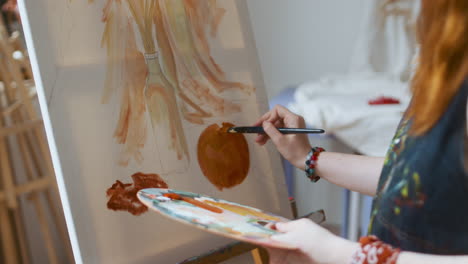 artist painting on a canvas