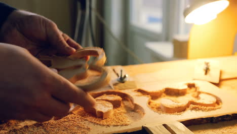 wood cut machine with drill is cutting out wooden molds. industrial wood cut machine with drill is cutting out wooden molds. small business concept