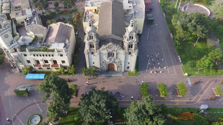 Drone video of church in Miraflores district of Lima Peru, near "Parque Kennedy" The shot is recorded while flying down and tilting camera up
