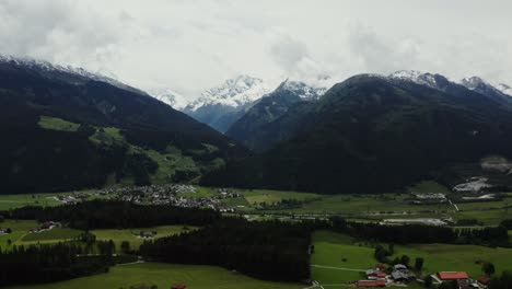 alpine valley with snow-capped peaks