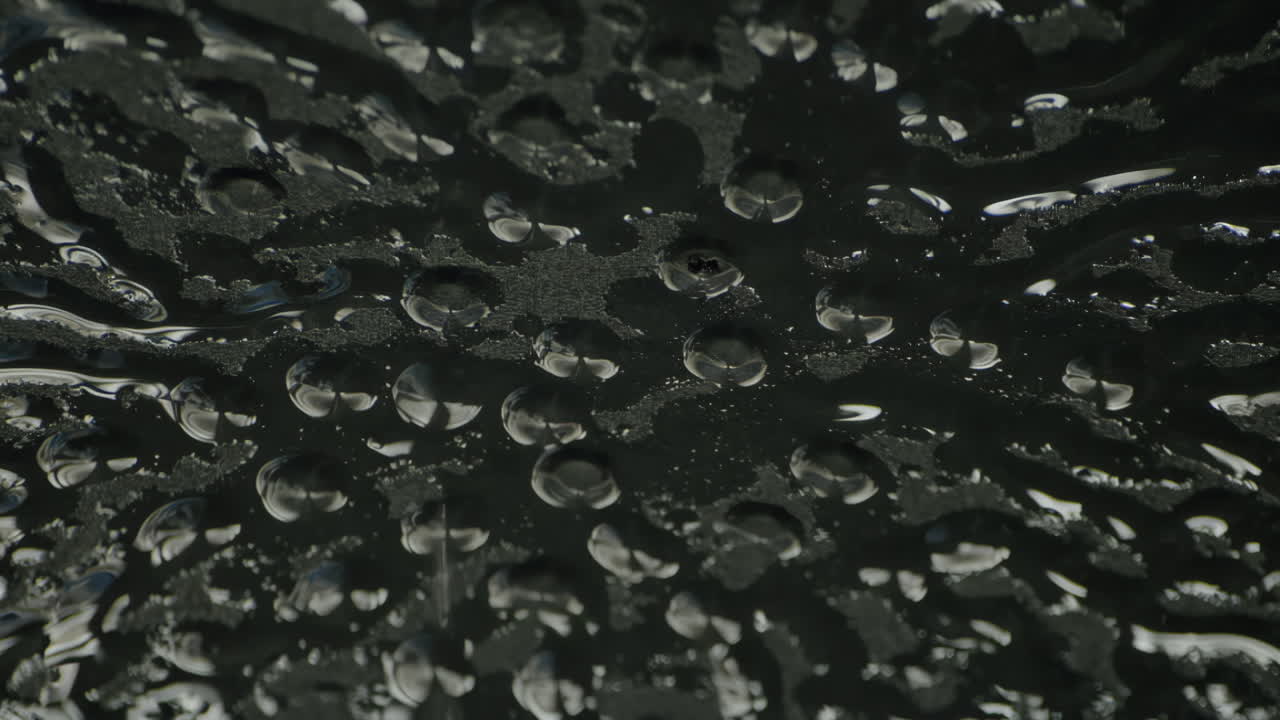 Close-up footage of water dripping from a damaged ceiling, highlighting urban decay, infrastructure problems, and the silent drama of leaks and water damage