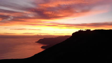 Aerial-sunset-on-the-ocean-and-mountain