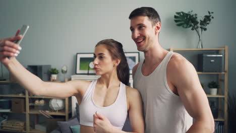 happy couple taking selfie at home