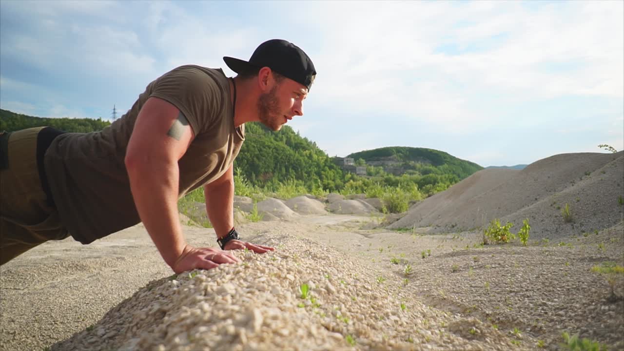 Man Doing Push-ups in a Quarry