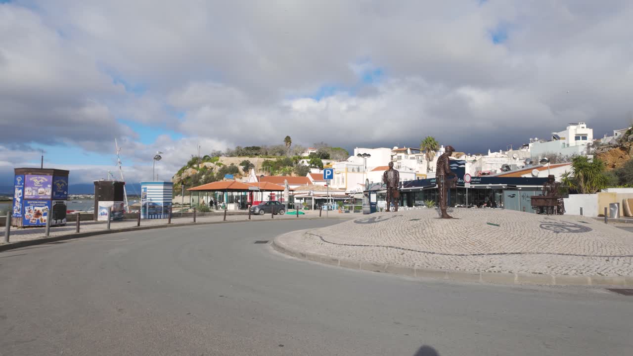 Roundabout with statues representing fishermen, located in the charming fishing village of Alvor, in the Algarve region, southern Portugal