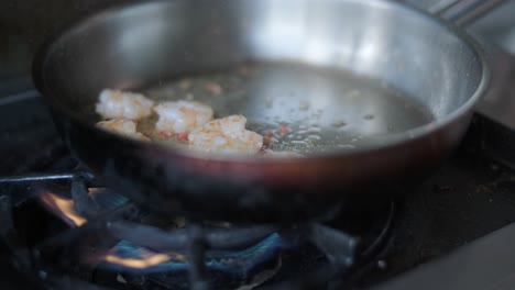 cooking shrimp in a pan