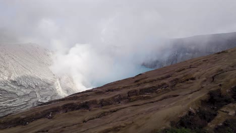 Breathtaking-Aerial-Landscape-of-Steam-from-Mount-Ijen-Lake-in-Indonesia