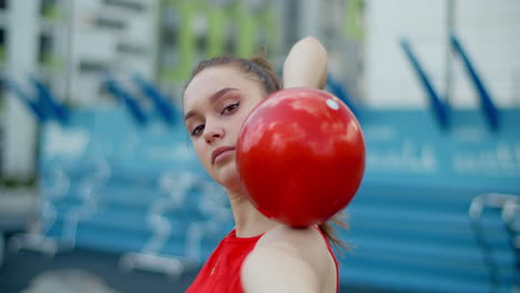 teenage gymnast with ball