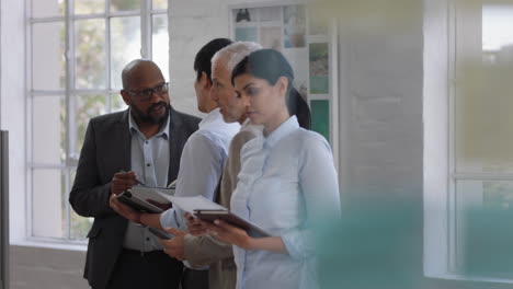 diverse business people working in busy office brainstorming creative ideas collaborating in corporate workspace