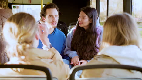 Two-young-couples-sitting-in-the-bus