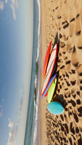 colorful surfboards on a sandy beach