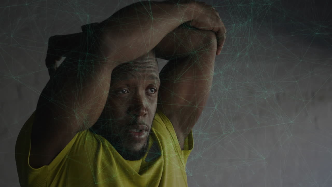 Stretching arms, man with digital network animation overlay on gray background