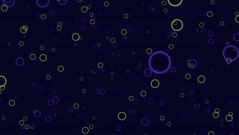 círculos coloridos forman un patrón en un fondo oscuro