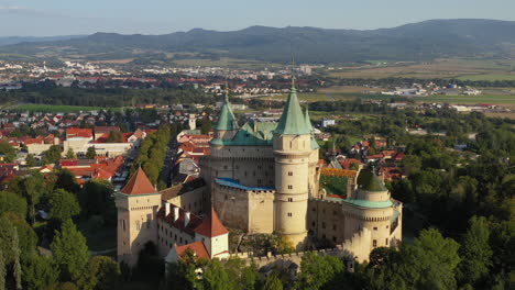 cinematic fly by drone shot of the castle of spirits or bojnice castle in slovakia