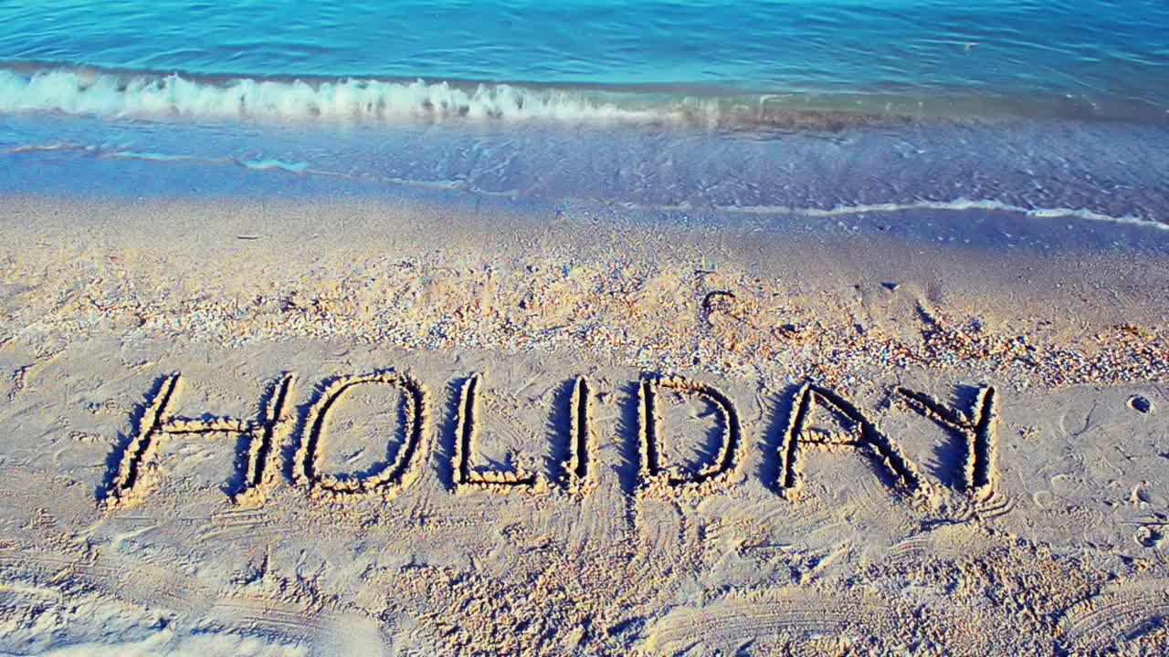 Opschrift Vakantie op zand, het strand. Opnamen op het strand.