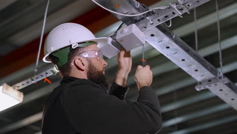 electrician working on a ceiling fixture