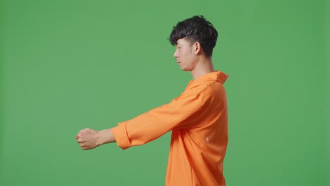 man in orange shirt, profile view