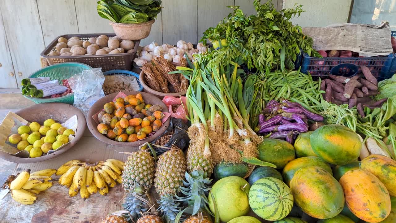 Mixed assortment of tropical fruit and vegetables on market stall in Sri Lanka