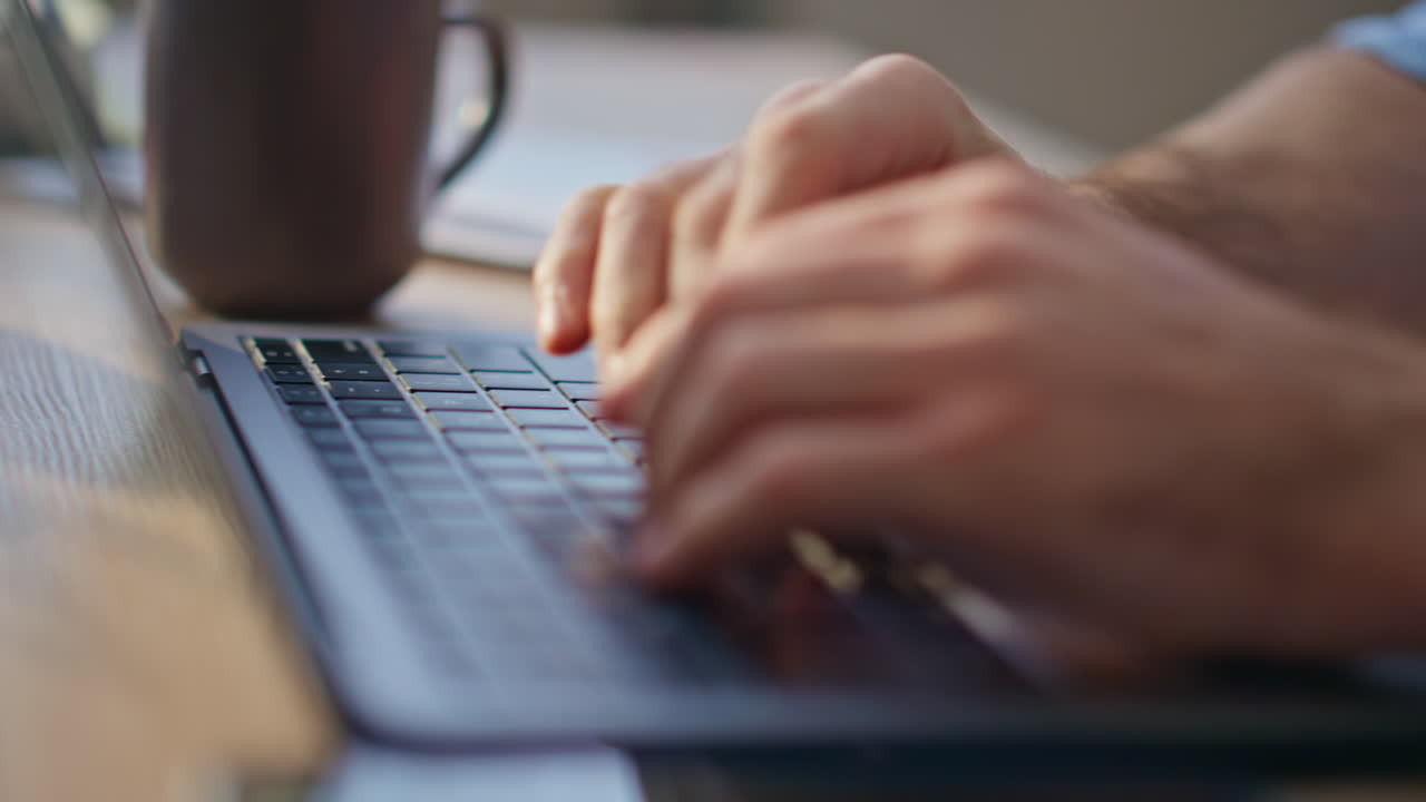 Employee hands writing notebook at desk closeup. Person typing laptop in office