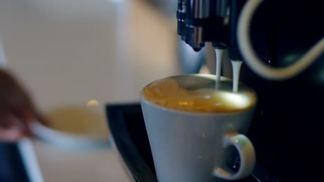 female executive preparing coffee in cafeteria at office 4k