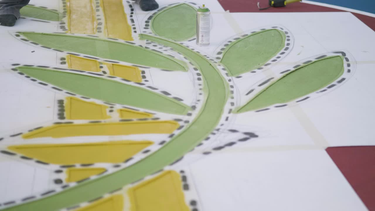 Paint worker using spray paint can for coloring, close up