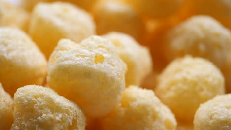 close-up of crunchy yellow corn puffs