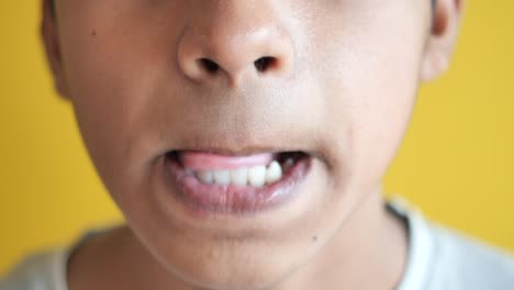 close-up of a child's face with mouth open and closed