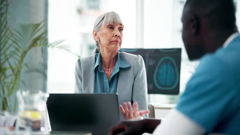 medical professionals discussing brain scan