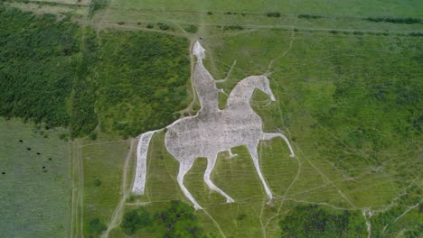 osmington white horse chalk figure hillside slope art aerial view orbit right