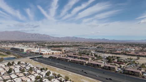 aerial view of traffic driving in parkway between summerlin in las vegas valley of southern nevada, usa