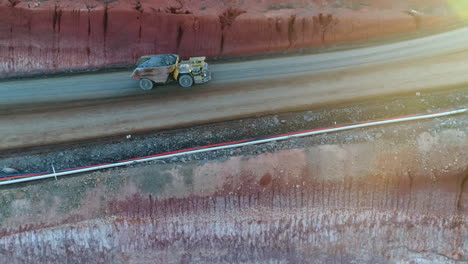 side view of truck entering mine pit